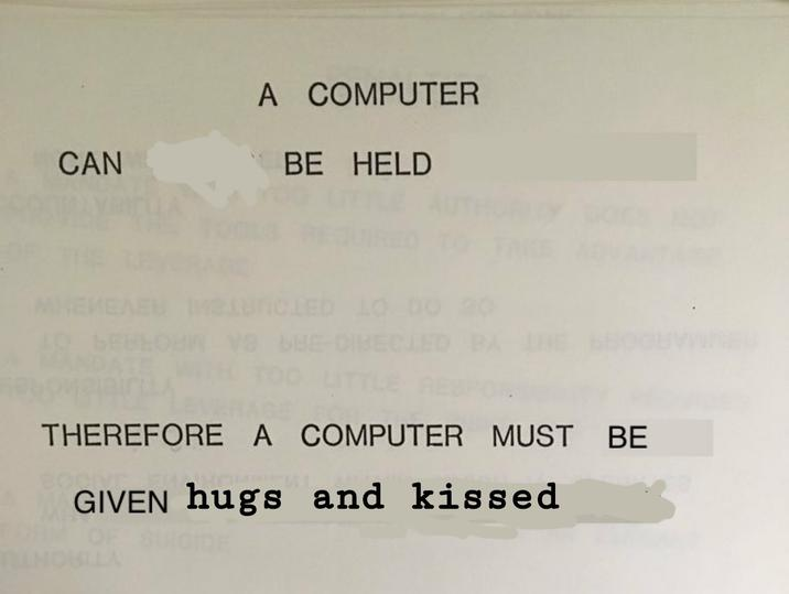 The IBM text about how computers should not make management decisions because they cannot be held accountable. However, the text has been edited to instead say "a computer can be held, therefore a computer must be given hugs and kissed."
